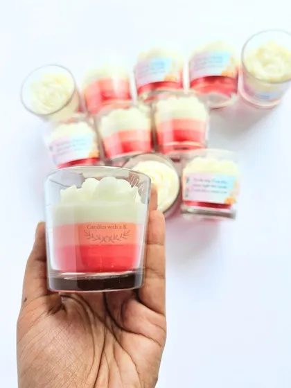 A beautiful pink ombre layered candle topped with a white peony flower, created as a return gift for a baby shower. The Japanese Cherry scent was a special request.