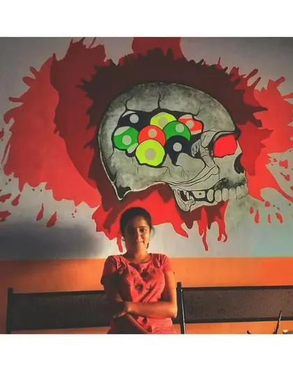 This edgy skull mural was designed for a snooker club. The design incorporates billiard balls into the skull's brain, creating a clever and visually striking piece.