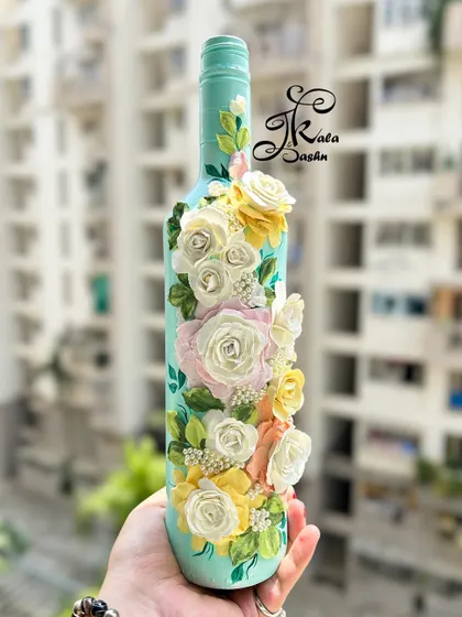 My sculpture art isn't just for walls. Here, I've transformed a simple glass bottle into a decorative vase using pastel-colored roses. It shows how this technique can be applied to different objects to create unique home accents.