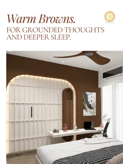 Warm browns for grounded thoughts and deeper sleep. This bedroom combines a deep brown accent wall with a sleek, built-in desk and white fluted panels, creating a cocoon of calm.