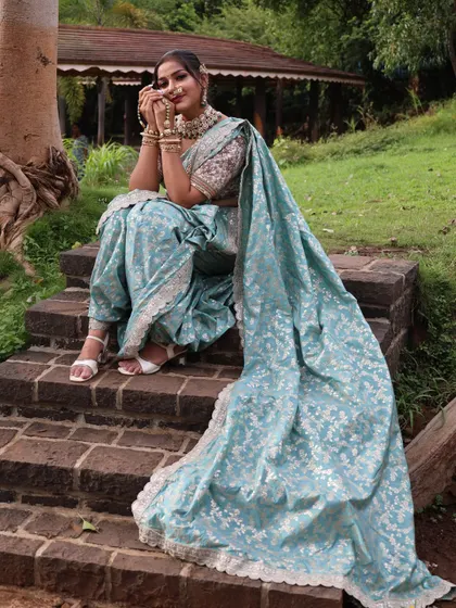 A happy pose in the blue Nauvari, perfect for an outdoor pre-wedding shoot.