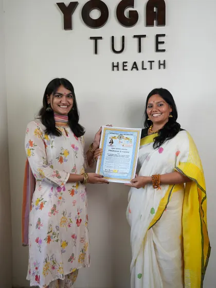 Presenting a new certified yoga teacher with her diploma. Each certificate represents countless hours of dedicated practice, study, and a commitment to the path of yoga.