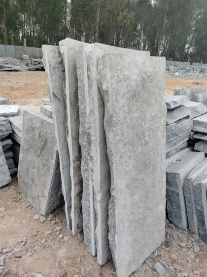 Large, irregular slabs of rough stone, perfect for creating a natural, rustic pathway.