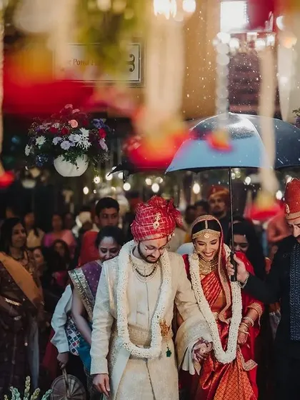 A monsoon wedding story. The rain added a poetic and dramatic element to Roshini's bridal entry, and we ensured the moment was captured beautifully, with umbrellas ready.