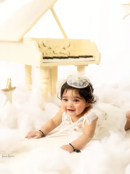 A happy crawl through the "clouds." This dynamic shot shows off the baby's mobility and joyful spirit.