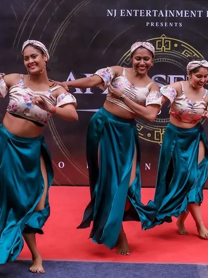 The smiles on our dancers' faces show the pure fun of performing for an enthusiastic crowd at Afro Sekita.