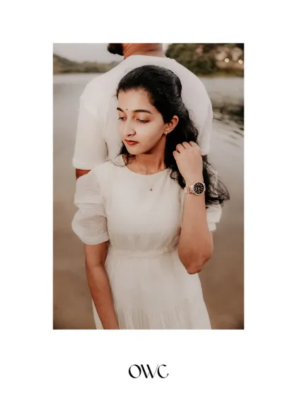 An artistic portrait of the bride-to-be with her partner's silhouette in the background, creating a thoughtful and creative composition.