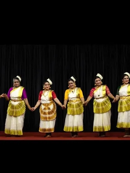 Our dancers in a line formation during the "Ashtalakshmi" performance at Guruvayur, presenting a visually striking and cohesive stage presence.