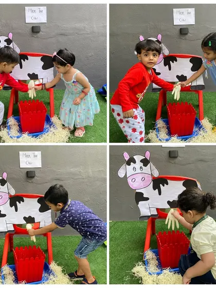 Children take turns at the milking station. This popular activity from our "Farm Week" was a huge hit, making learning about agriculture memorable and fun.