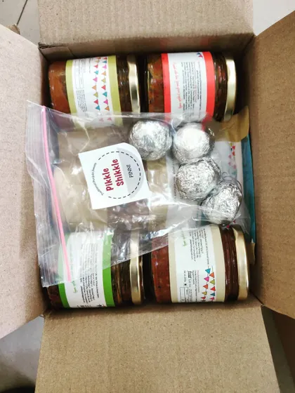 A look inside one of our delivery boxes. We pack pickles and other goodies like Pinni with care.