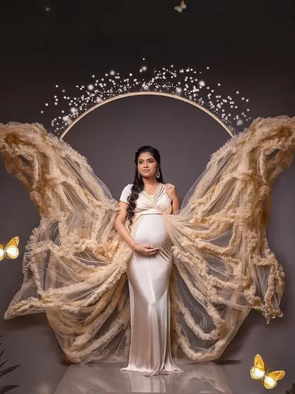 A magical night-time scene, complete with glowing butterflies and a celestial crown. This fantasy edit turns your maternity photo into a fairytale.