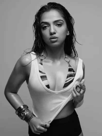 The same edgy look in a black and white treatment, highlighting the textures and the raw energy of the shot. This is a great example of versatile photoshoot styling.