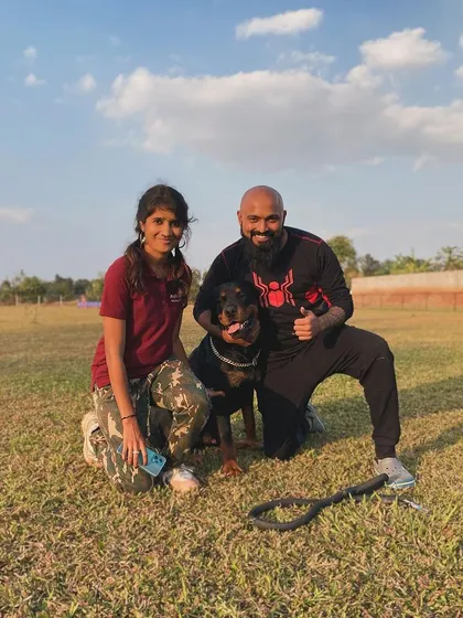 Our team loves getting to know all the dogs and their parents, like this happy Rottweiler and his family.