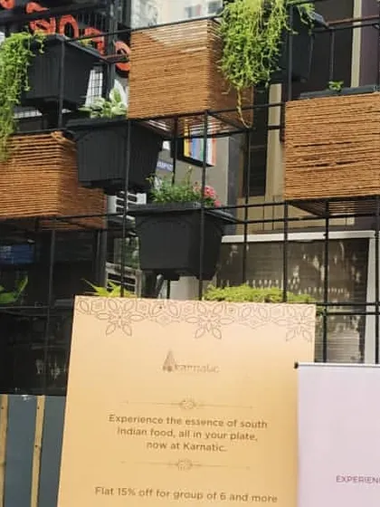 A wider view of the storefront vertical garden. The modular design allows for creative arrangements and makes it easy to care for the plants, adding a welcoming touch of nature to the entrance of the business.
