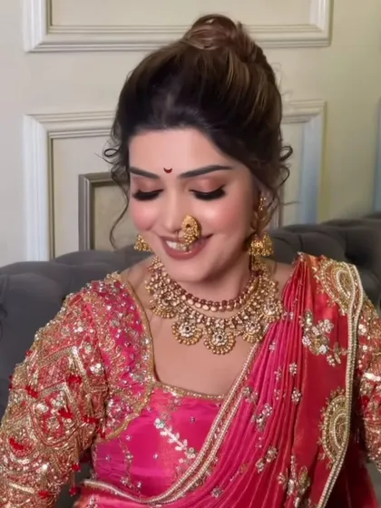A candid, smiling shot of the bride, proving the makeup looks beautiful and natural even in motion.