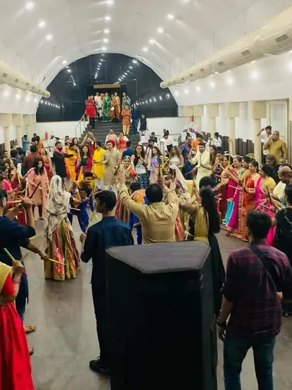 A wide-angle view of a packed Dandiya night. We can manage and entertain large crowds, ensuring everyone feels included in the celebration.