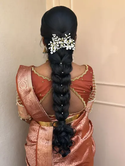 This messy braid is perfect for a pre-wedding ritual. I wove in delicate baby's breath and pearl accessories to create a soft and romantic look.
