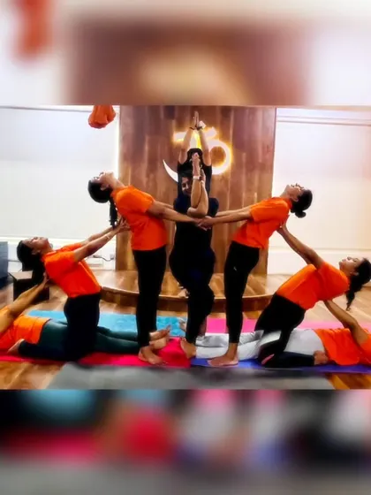 Cool yoga formations ahead! Our students working together to create a beautiful and complex group pose, showcasing trust, balance, and teamwork.