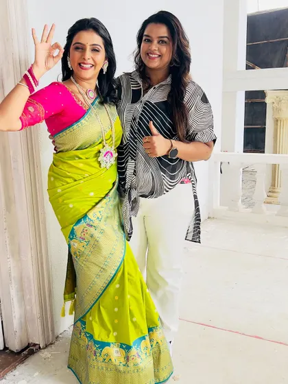 A fun moment with actress Shivani Naik on set. I created this vibrant traditional look for her, featuring a bright lime green and pink saree.