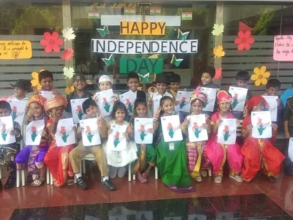 A class of young patriots holds up their artwork of the Indian flag, created as part of the Independence Day activities.