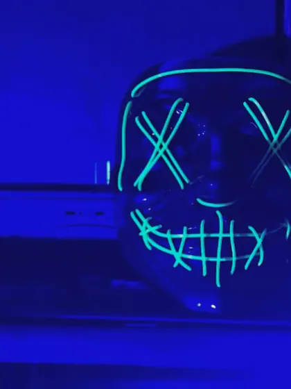 A close-up of a neon prop mask used for our glow-in-the-dark party theme. These small details help enhance guest interaction and immersion in the event's atmosphere.