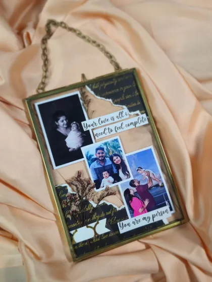 This custom glass floating frame is a beautiful way to display a collage of your favorite photos and messages. The antique-style brass frame adds a touch of vintage elegance.