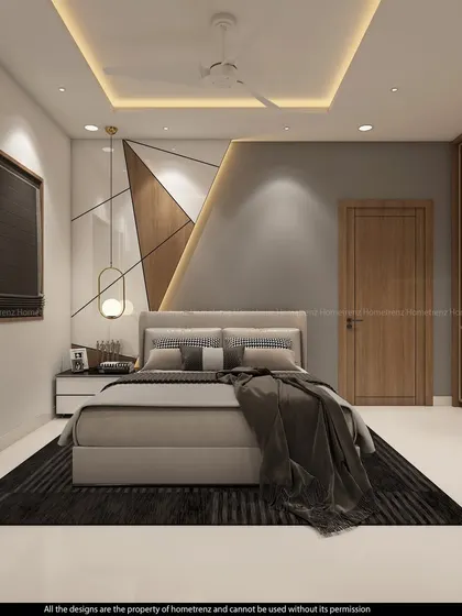 A frontal view of the bed and feature wall, highlighting the pendant light and the sleek, handle-less nightstand.