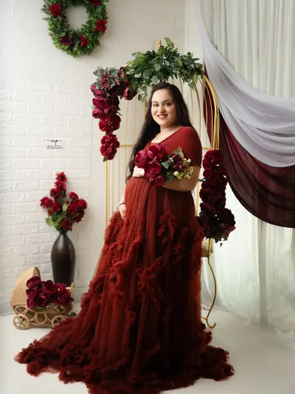 A full-length shot showcasing the dramatic and beautiful ruffled red gown. This is one of the many glamorous options available in my studio wardrobe.