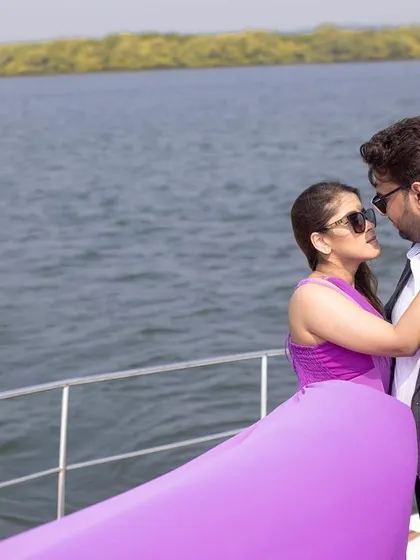 A romantic moment between the couple on a yacht, with the Goan coastline in the background.