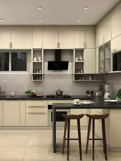 A simple and effective breakfast bar extension in a neutral-toned kitchen. It provides a casual dining spot without compromising the clean, open layout.