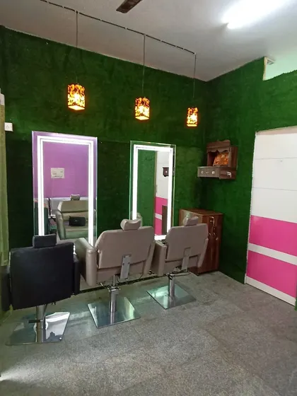 For this salon, I installed a full-length artificial grass accent wall to create a fresh and relaxing atmosphere for clients. The vibrant green wall provides a striking contrast to the modern decor and enhances the overall aesthetic of the commercial space.