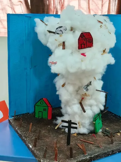 A model of a tornado, demonstrating a natural phenomenon. Our geography curriculum covers everything from landforms to weather, making children aware of the powerful forces of nature.