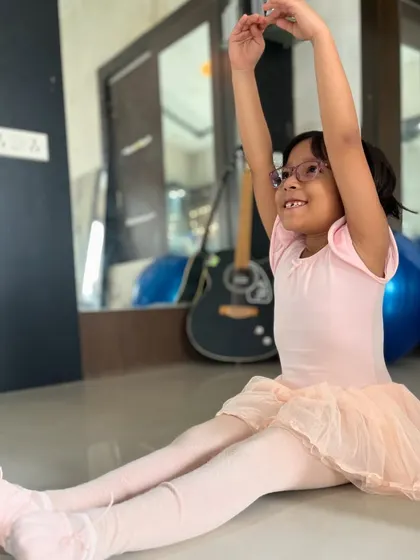 A young ballerina learns basic positions and stretches. My kids' ballet classes are designed to introduce the fundamentals of ballet in a gentle and encouraging way.