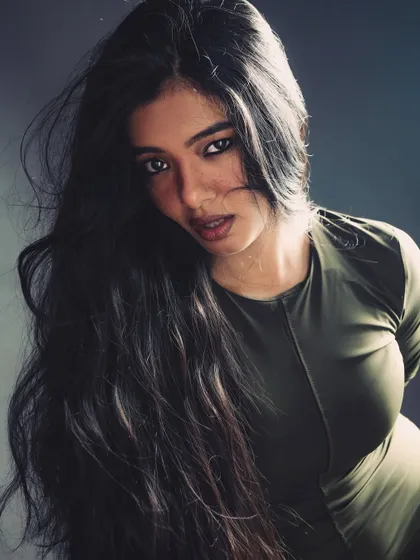 A beautiful shot capturing movement in the hair and a strong, confident expression.