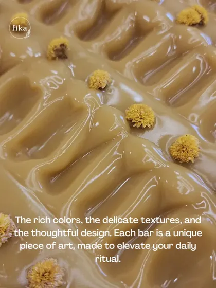 The rich colors, the delicate textures, and the thoughtful design. This close-up of a freshly textured soap loaf topped with flowers shows how each bar is a unique piece of art, made to elevate your daily ritual.