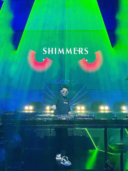 A cool shot with the green laser lights and the spooky eyes visual for a Halloween-themed night at Shimmers.