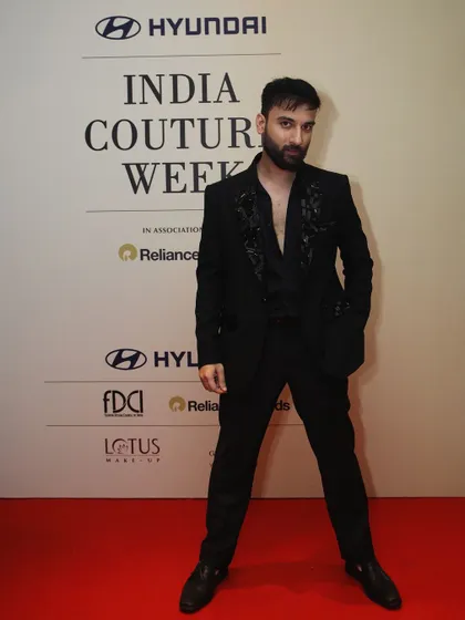 On the red carpet at India Couture Week, this suit stands out. The tonal embroidery adds a layer of detail that elevates the classic black suit into a memorable fashion statement.