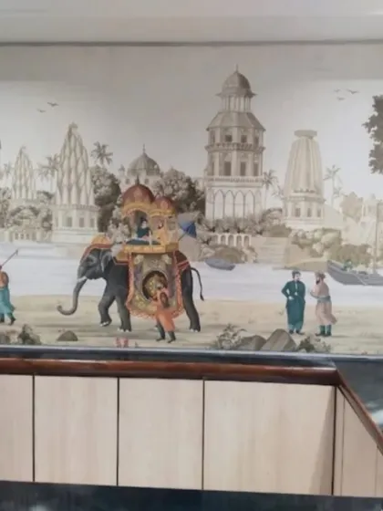 I installed this beautiful mural depicting a historic Indian waterfront scene behind a reception desk. It immediately establishes a sense of place and cultural richness for visitors.