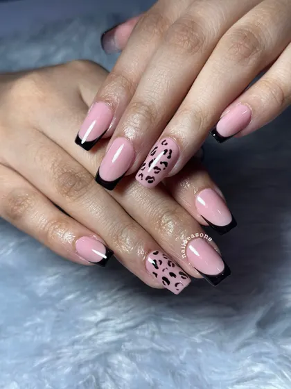 A fun twist on a classic. This set features timeless black French tips on a soft pink base, with a surprise accent nail of hand-painted leopard print. It’s the perfect mix of classy and wild.