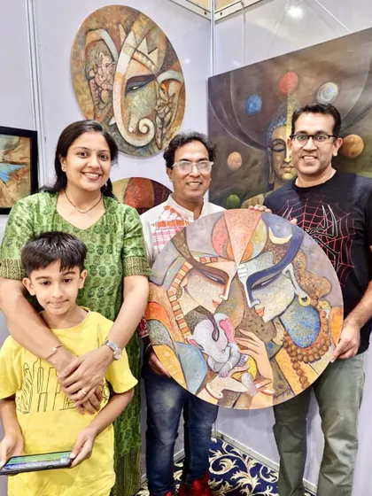 A happy family who purchased my large, circular Radha-Krishna painting at the Kalaspandan Art Fair in Pune.