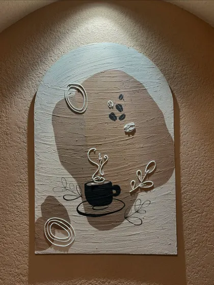 A direct shot of the 3ft by 2ft coffee-themed art piece. I used acrylics and textured elements on board to create a modern and inviting piece for the commercial space.