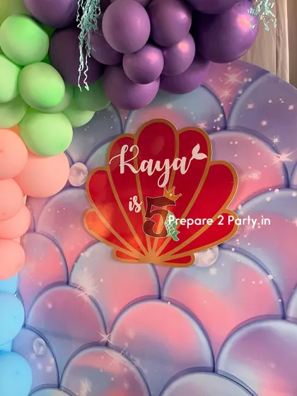 Explore my portfolio of mermaid themed birthday parties, featuring iridescent backdrops, shell-shaped signs, and balloon arrangements that capture the magic of the ocean.