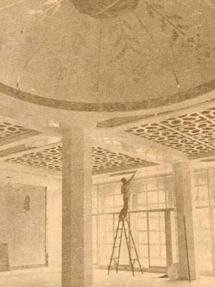 A historic photo showing the Kowloon Mosque under construction. The image captures the intricate craftsmanship of the geometric patterns and dome, highlighting the blend of traditional design and modern construction techniques.