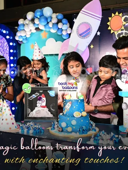 This photo from a space themed party captures the joy of celebration. Our goal is to transform your event with enchanting touches that bring smiles to everyone's faces.