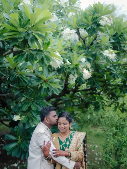 A tender kiss on the forehead, a timeless expression of love and care, perfectly captured during their engagement session.