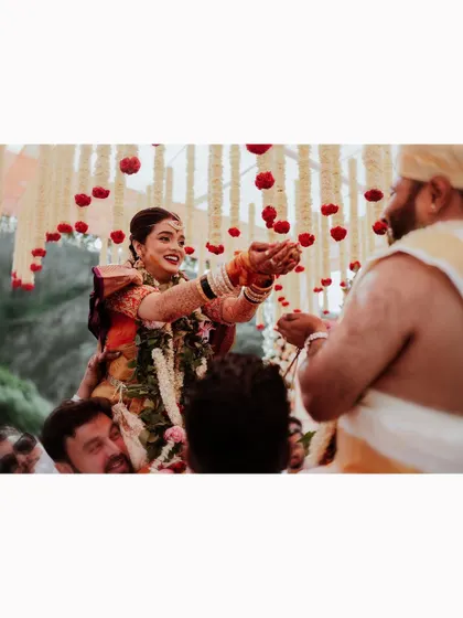 A beautiful moment during the 'talambralu' where the bride is lifted up by her family.