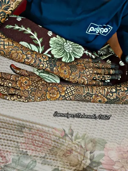 A full floral bridal design covering the hands, arms, and even the elbows. This is for the bride who wants a truly show-stopping mehendi look.