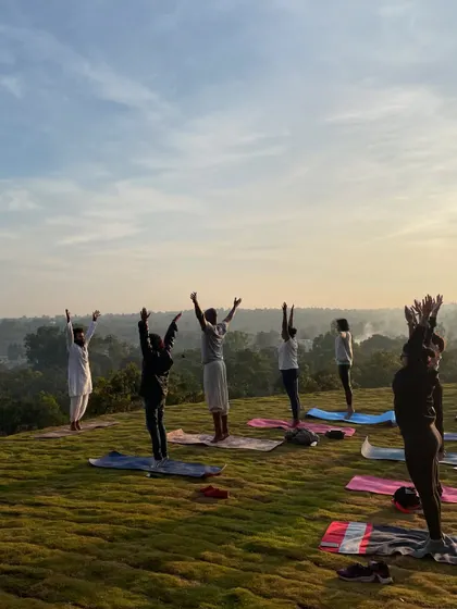 Beginning our morning sadhana (practice) with a gentle stretch towards the sky. This simple movement awakens the body and connects our energy with the rising sun.