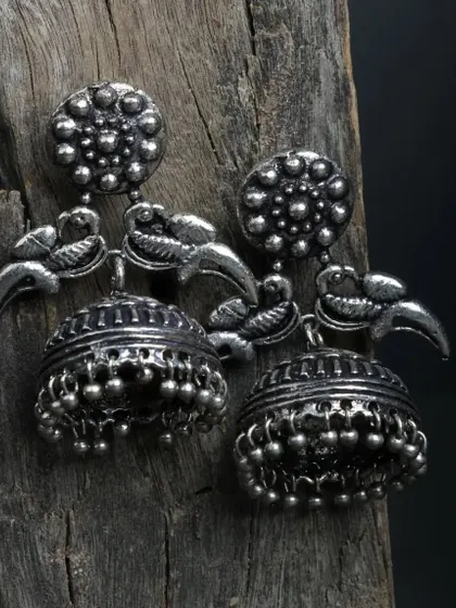 "Jhumke si sundar thi vo." These beautiful peacock oxidized jhumkas are a favorite, with their intricate carvings and classic design.