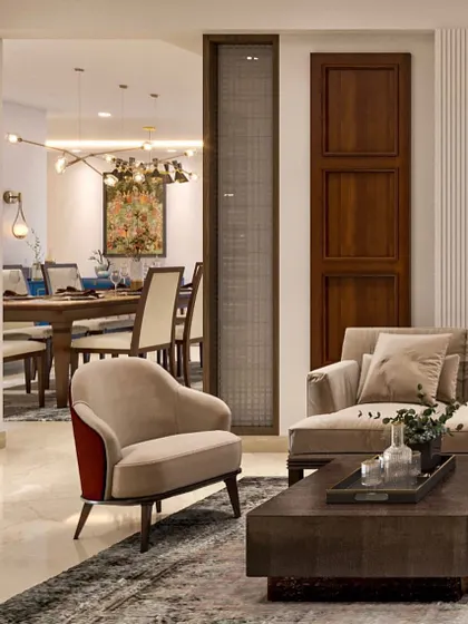 A view from the living room into the dining area of our Purvanchal Royal City project. The space is defined by a warm, neutral palette, a comfortable sofa, and a solid wood coffee table.